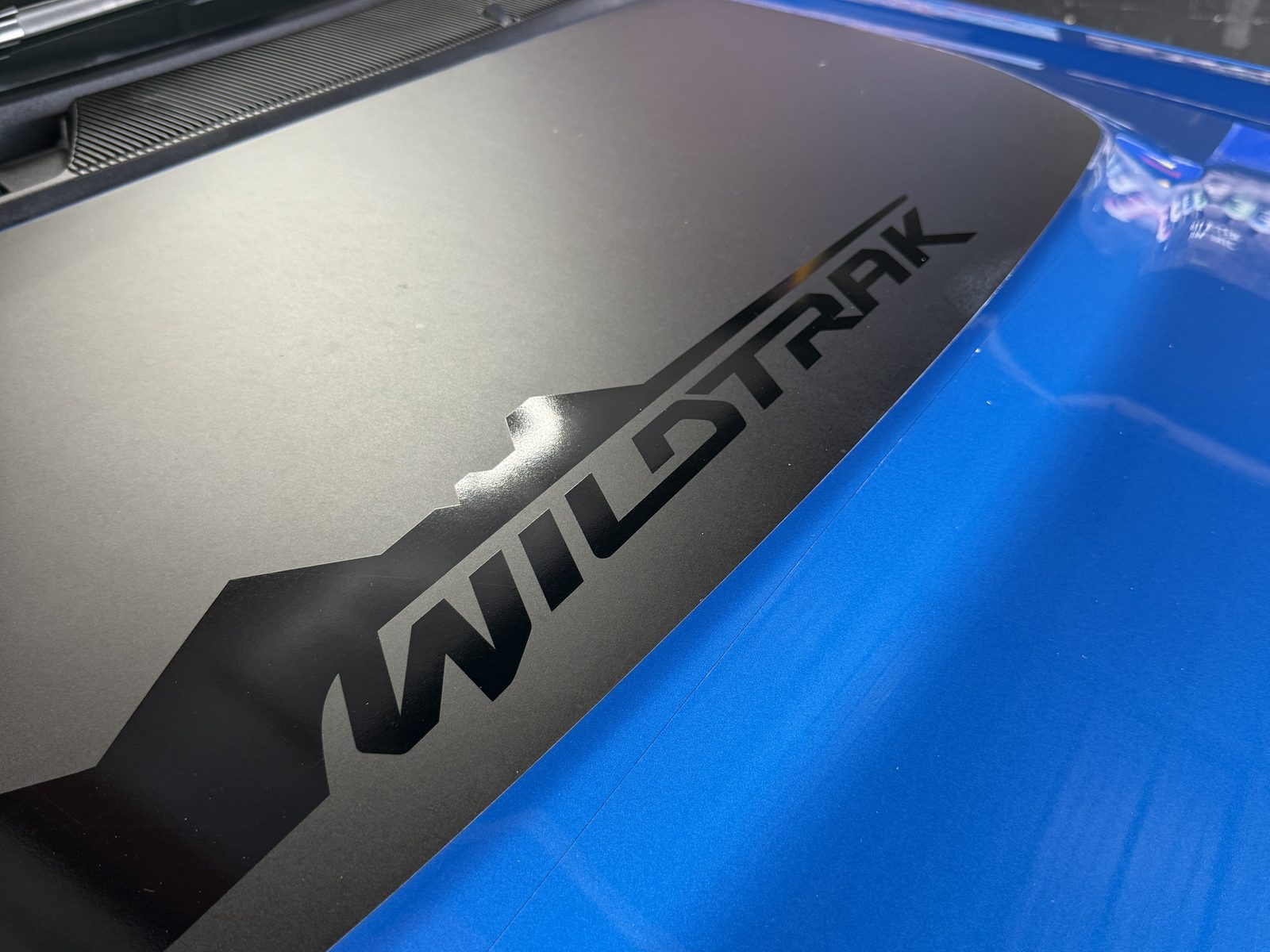Deep blue gloss on a Bronco hood