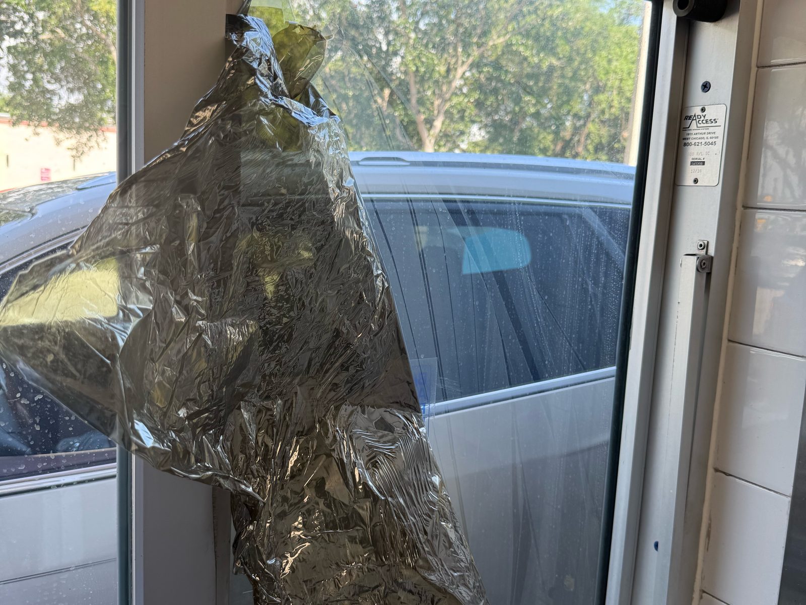 Old film being peeled off glass