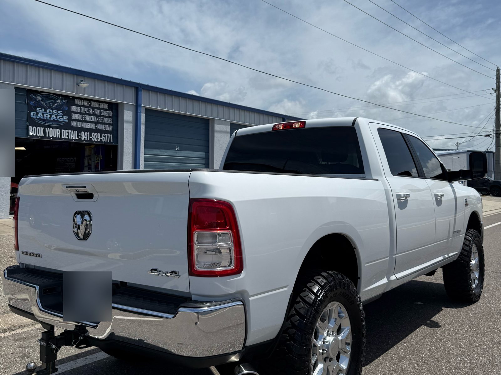 White Ram pickup parked outside the Gloss Garage Details shop on Seaboard Ave