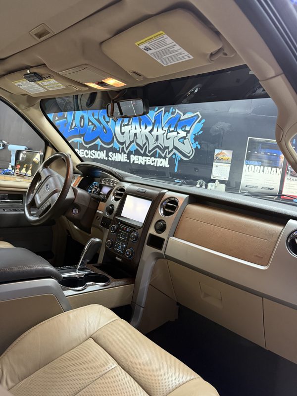 Clean dash with the Gloss Garage mural visible through the windshield