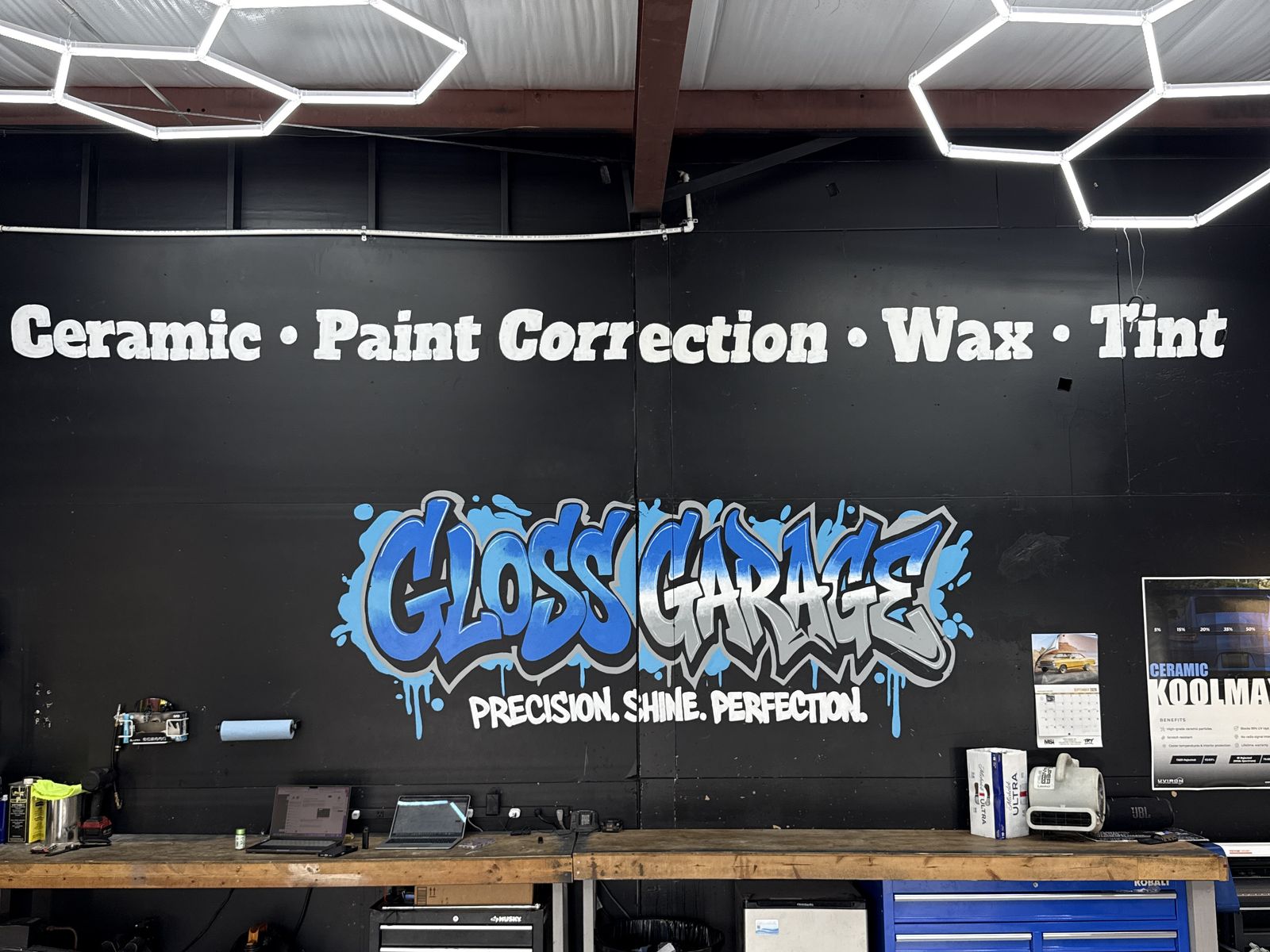 Gloss Garage graffiti mural under hexagon LED lights