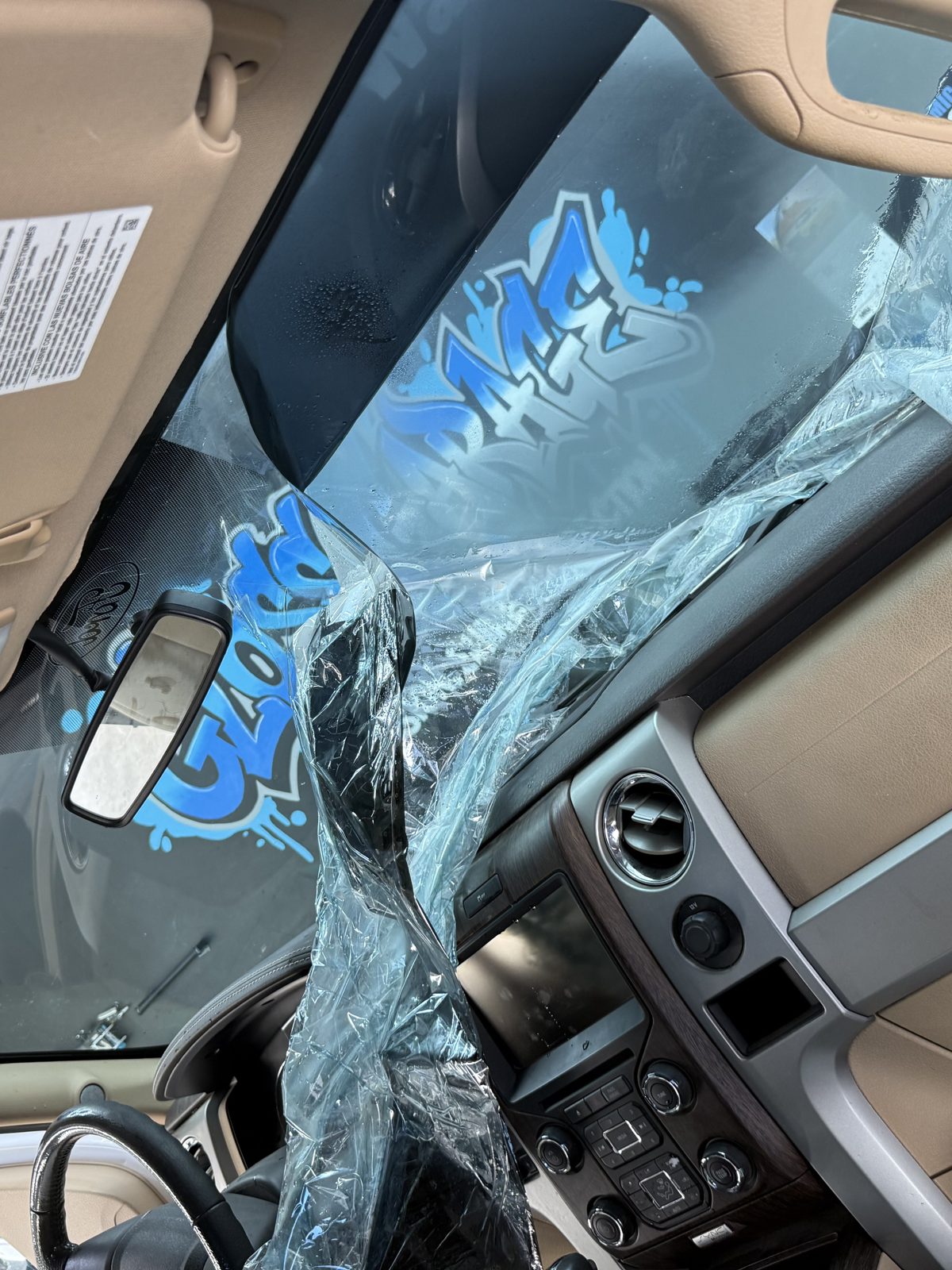 Film being fitted from inside an F-150 cab