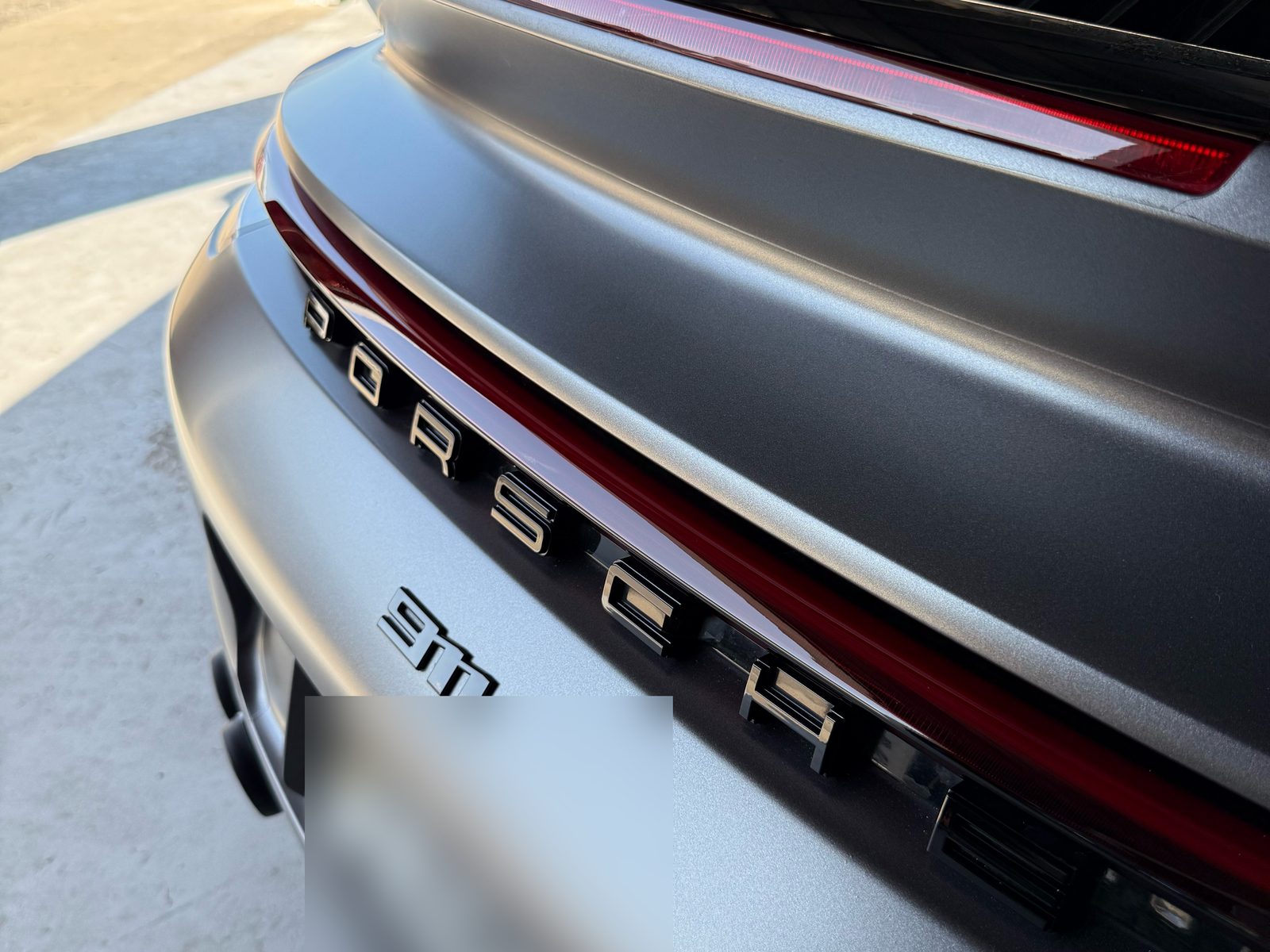 PORSCHE lettering on the satin gray rear